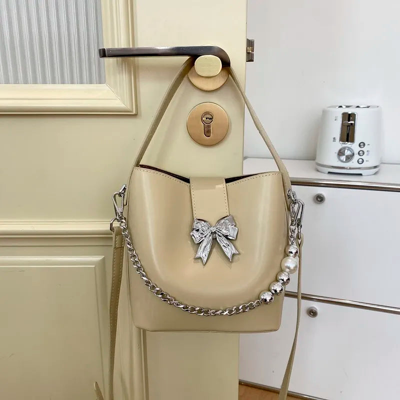 nvxiot - Spring/Summer 2024 new, solid color PU women's shoulder bag, silver bow decoration, fashion trend