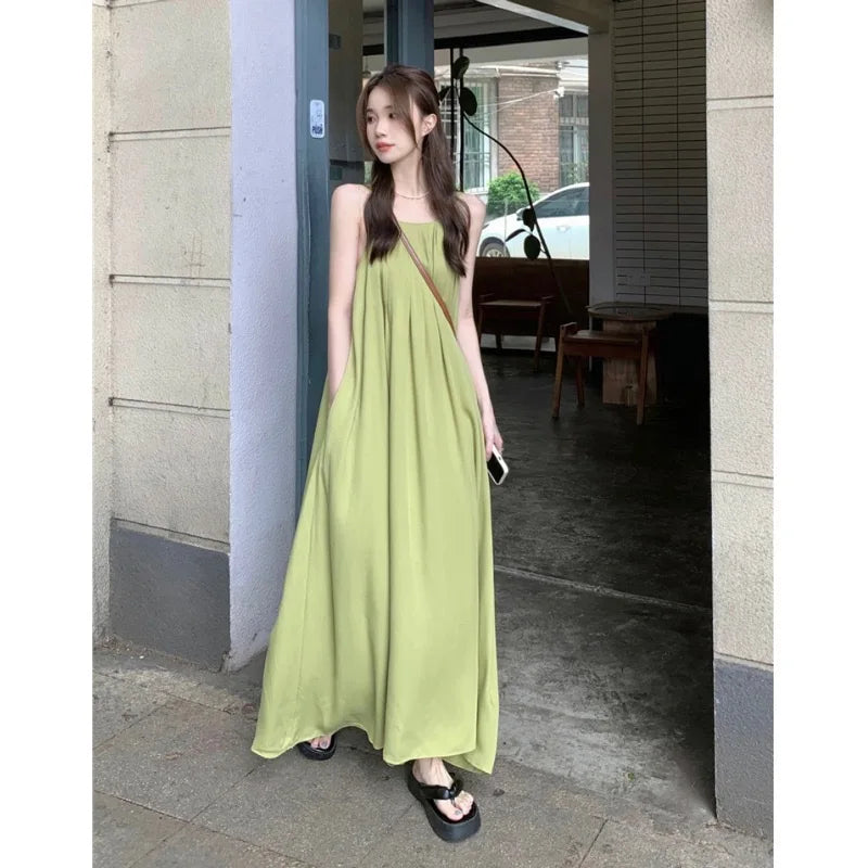 MQTIME - Elegant and versatile dress for women's summer 2024 new seaside vacation style beach skirt pleated suspender long skirt