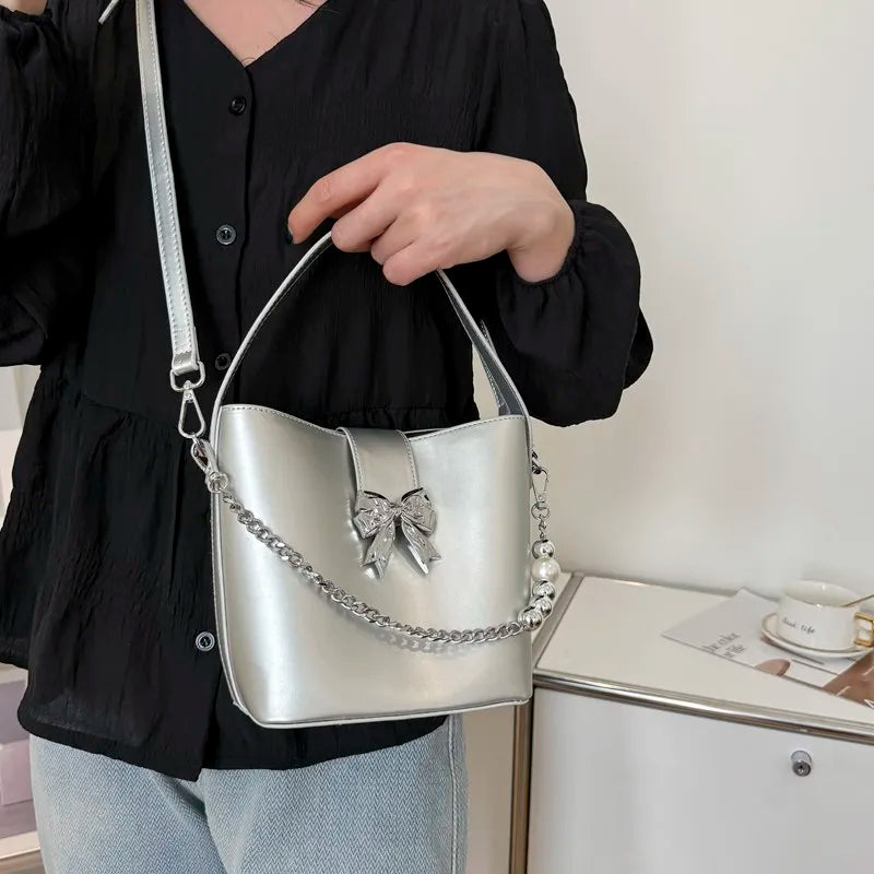 nvxiot - Spring/Summer 2024 new, solid color PU women's shoulder bag, silver bow decoration, fashion trend