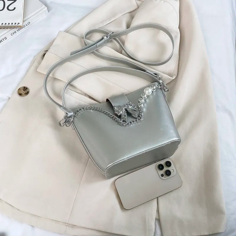 nvxiot - Spring/Summer 2024 new, solid color PU women's shoulder bag, silver bow decoration, fashion trend