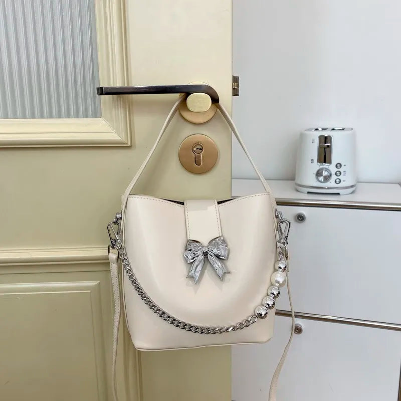 nvxiot - Spring/Summer 2024 new, solid color PU women's shoulder bag, silver bow decoration, fashion trend
