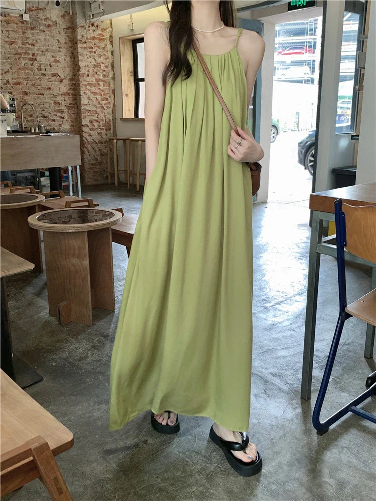 nvxiot  -  Elegant and versatile dress for women's summer 2024 new seaside vacation style beach skirt pleated suspender long skirt