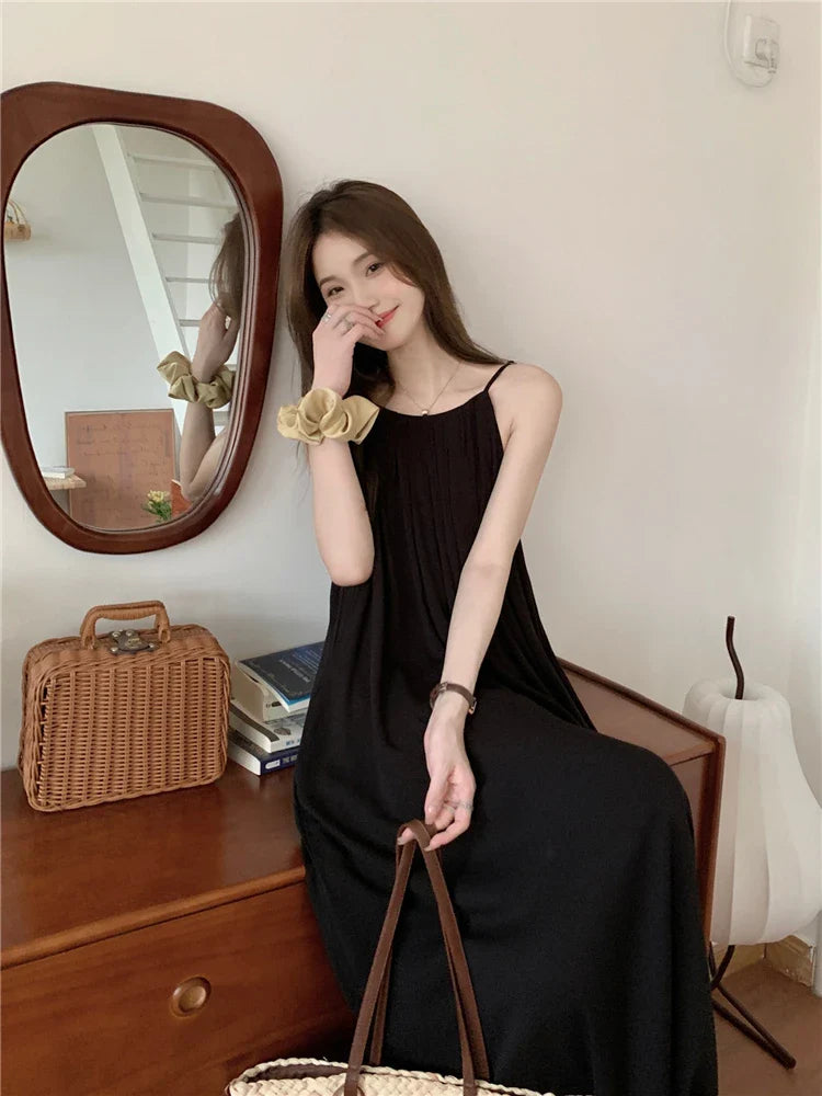 nvxiot  -  Elegant and versatile dress for women's summer 2024 new seaside vacation style beach skirt pleated suspender long skirt