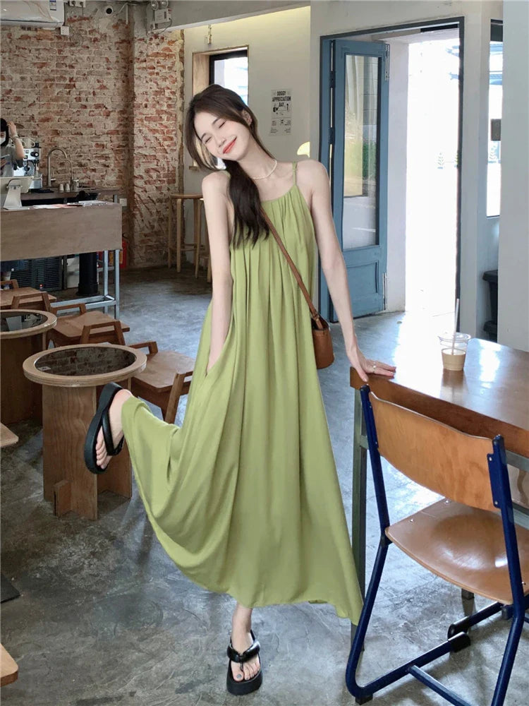 nvxiot  -  Elegant and versatile dress for women's summer 2024 new seaside vacation style beach skirt pleated suspender long skirt